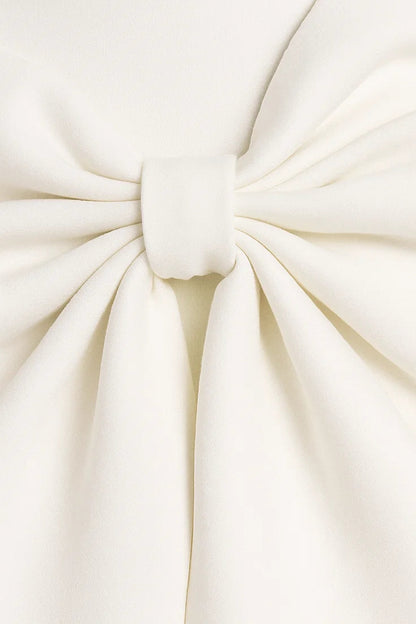 Close-up detail of the large cream bow, showing soft gathered folds and a wrapped centre knot 2
