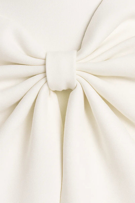 Close-up detail of the large cream bow, showing soft gathered folds and a wrapped centre knot 2