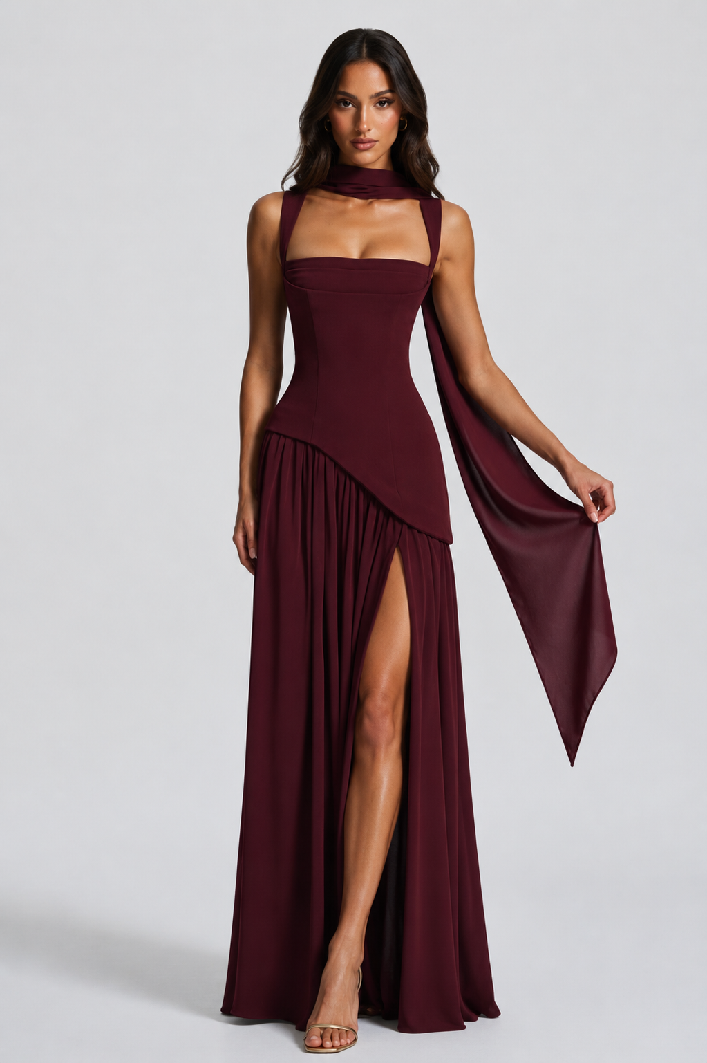 Burgundy version with the scarf draped over one arm and held out, showing the high slit and asymmetric waist seam. 9