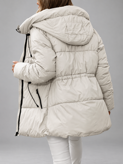 Back view of the cream padded coat showing the hood, gathered waist and quilted panels 9