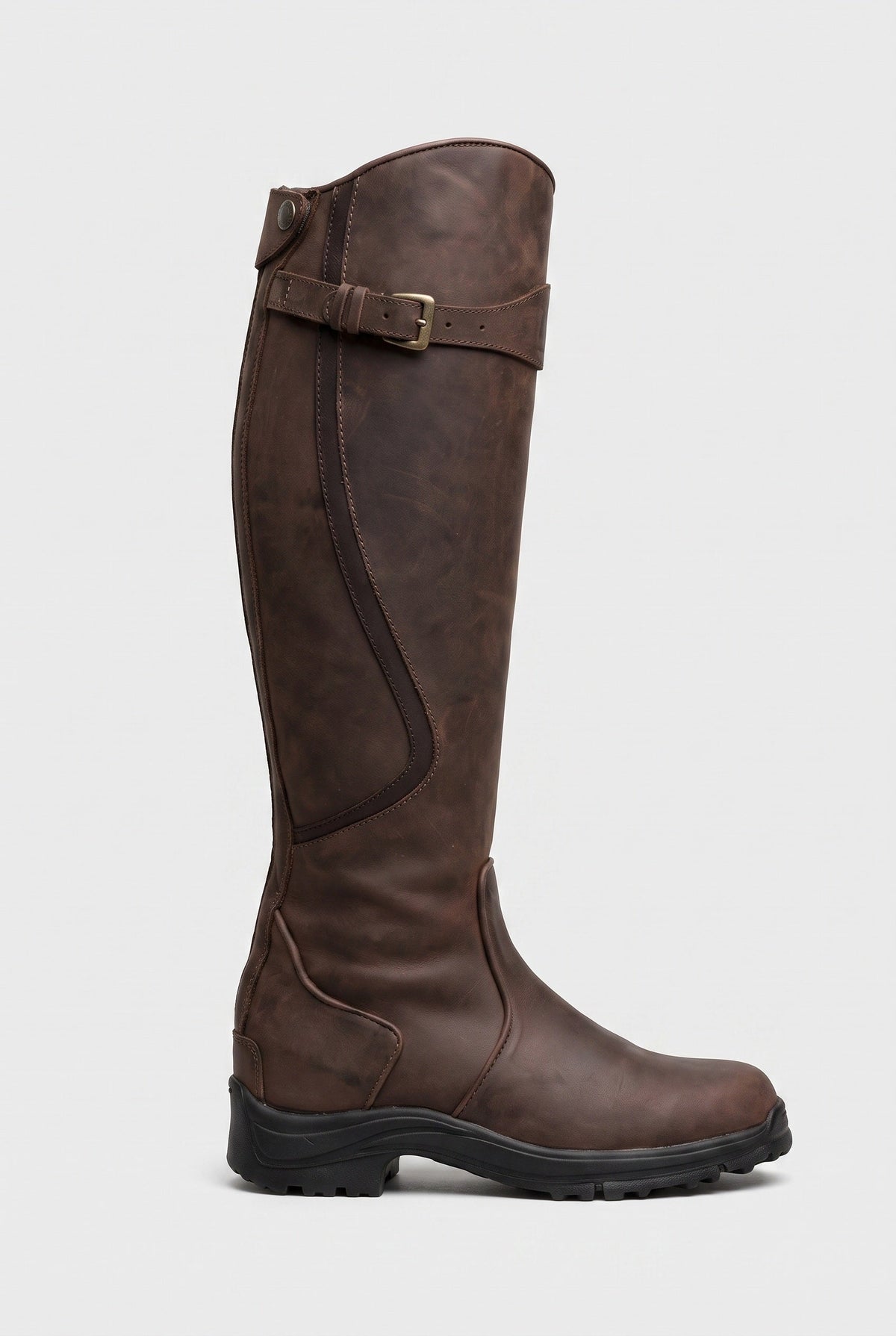 Side view of a dark brown leather knee-high boot with brass buckle strap and black lug sole 1