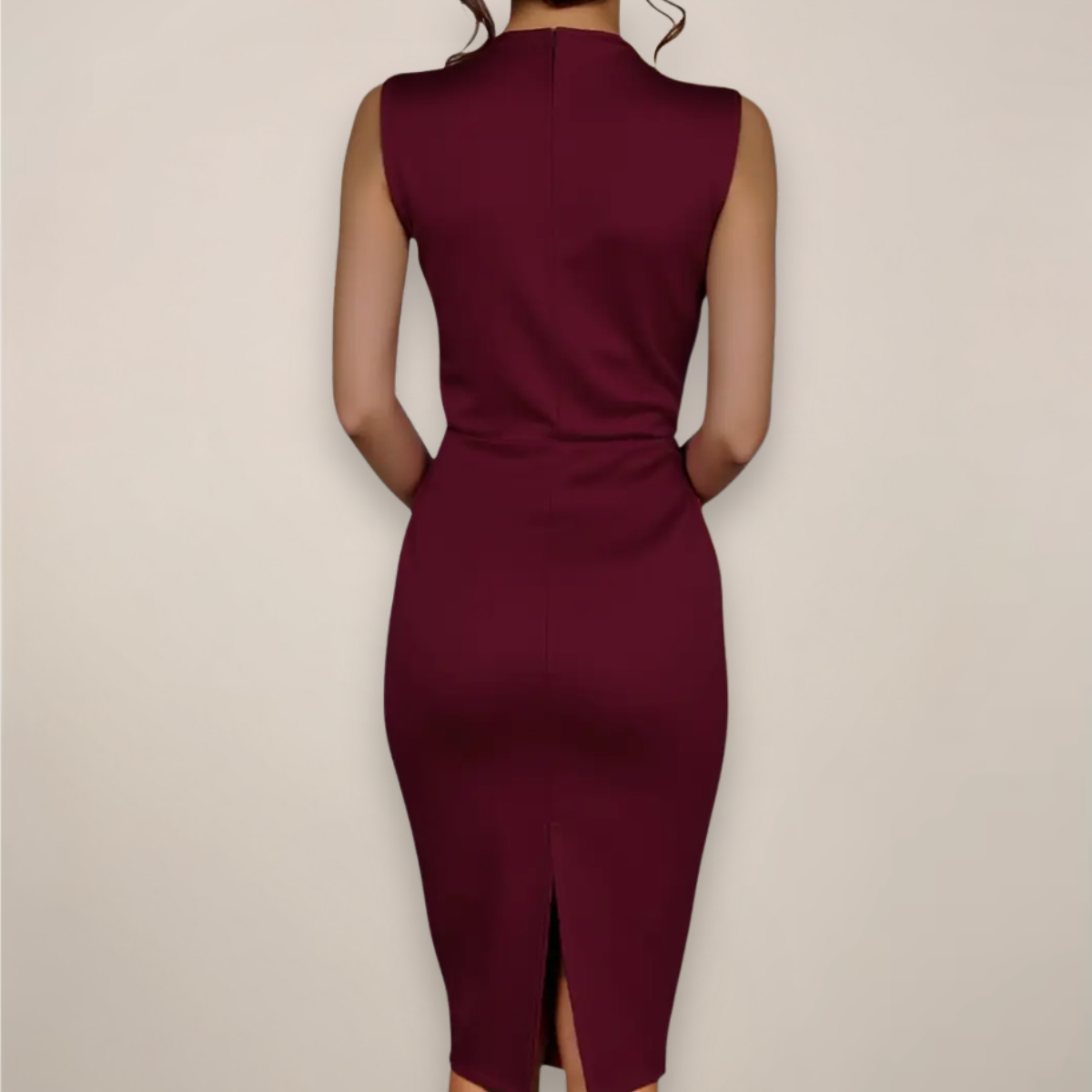 Back view of the burgundy dress on a model, showing the plain fitted back and centre vent at the hem. 2