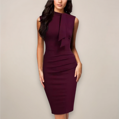 Model wearing the burgundy sleeveless sheath dress, front view showing the draped neck tie and ruched side waist. 1
