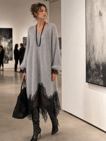 Model wearing the grey knit dress with lace hem while looking at paintings in an art gallery 3