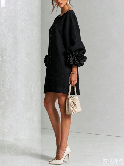 Side view of the black dress, showing the puff sleeve and rose cuff with a small handbag 16