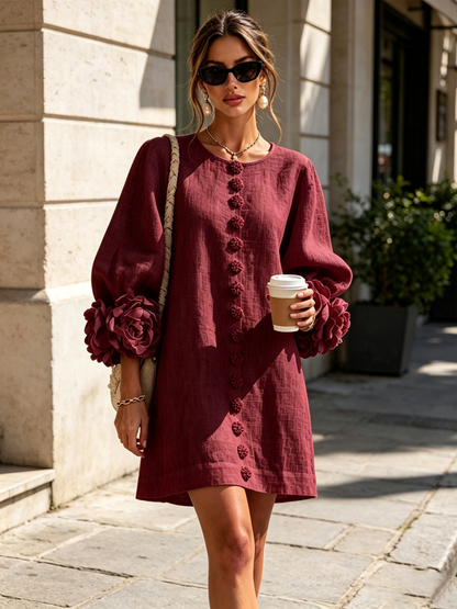 Burgundy dress worn outdoors on a sunny pavement, with rose cuffs, floral buttons and a coffee cup 38