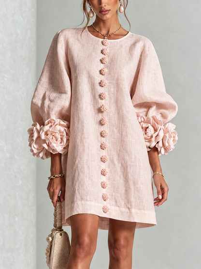 Pale pink version worn from the front, with flower buttons and large rose appliqués at the puff-sleeve cuffs 5