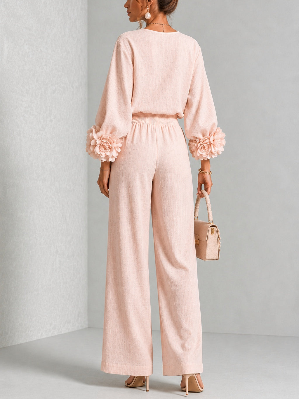 Back view of the pink set, showing the gathered elastic waist, plain back and flowers on both cuffs 9