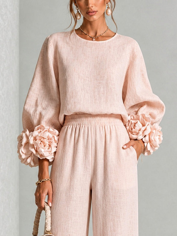Close-up of the pink top from the waist up, showing the round neckline, puffed sleeves and cuff flowers 8
