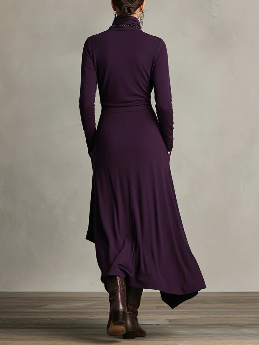 Back view of the purple dress showing a plain fitted back, waist seam and uneven hem 2