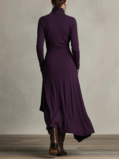 Back view of the purple dress showing a plain fitted back, waist seam and uneven hem 2