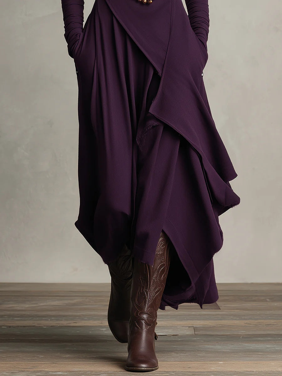 Close-up of the purple skirt's layered, asymmetric draped panels with raw-edge hem over brown boots 5