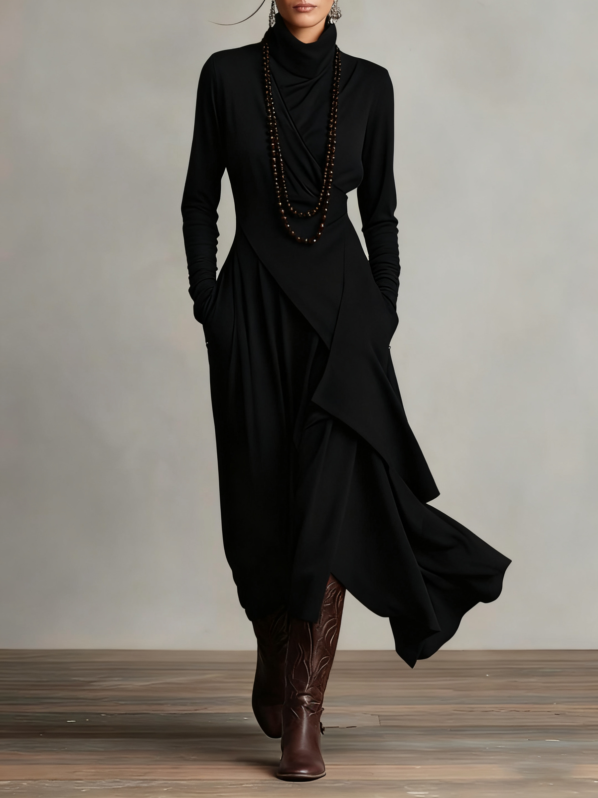 Front view of the black dress worn with beaded necklaces and tooled brown leather boots 6