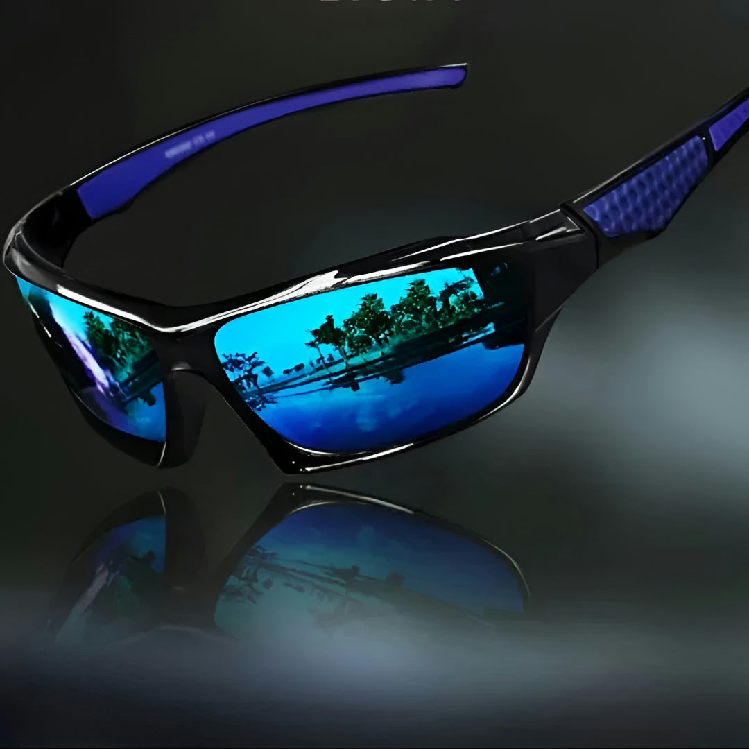Sunglasses with blue mirrored lenses and blue patterned arm inserts, angled view on a dark reflective surface 7