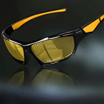 Sunglasses with yellow tinted lenses and orange-yellow arm inserts, angled view on a dark reflective surface 9