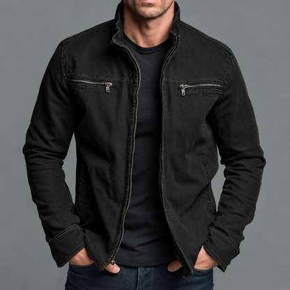 Man wearing the jacket in washed black, zipped chest pockets and stand collar, over a black tee 5