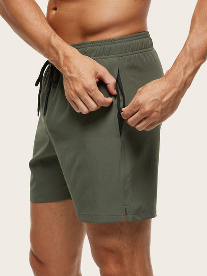 Close-up of the olive green shorts' side zip pocket being opened, with the small side vent at the hem. 4