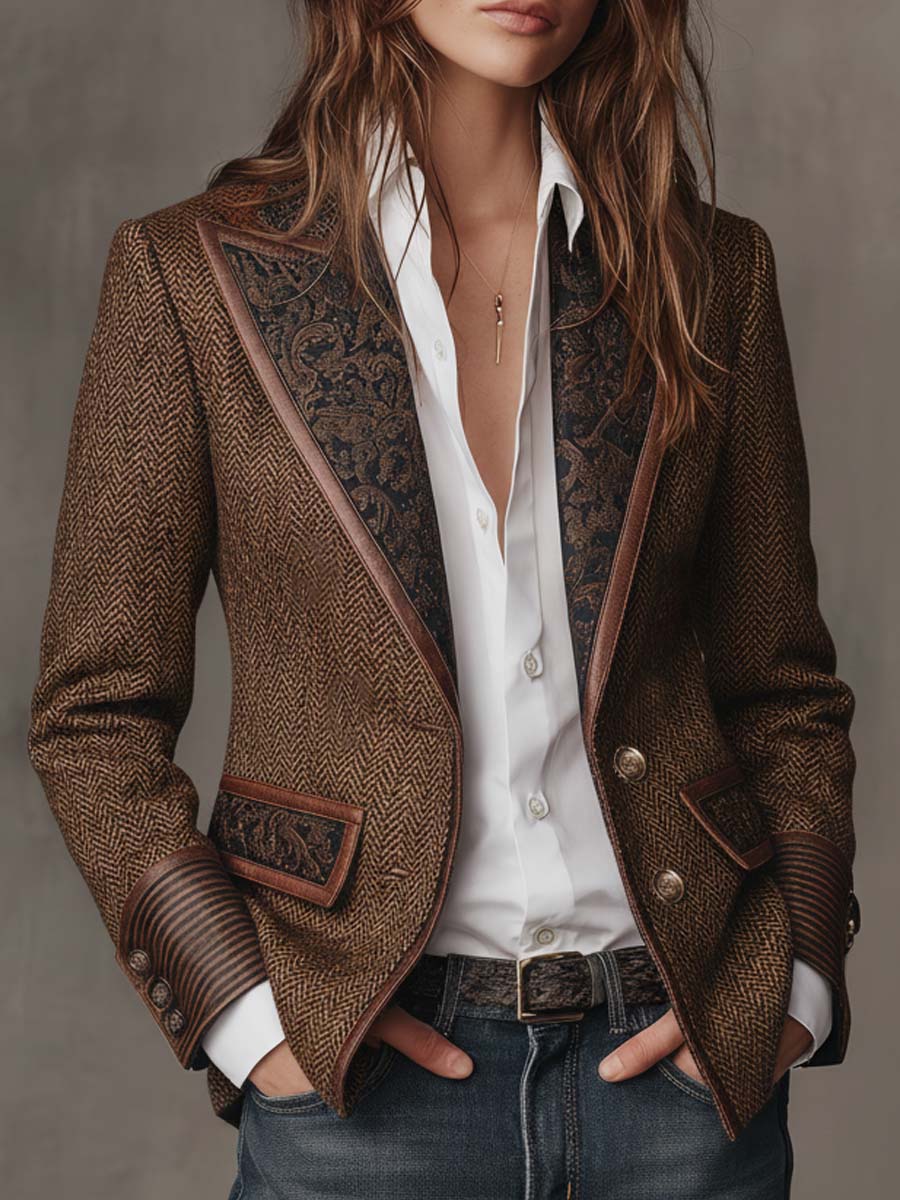 Model wearing the brown herringbone blazer open over a white shirt and jeans, hands in pockets 1