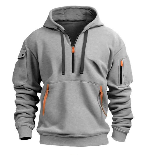 Light grey hooded top, front view, with orange zip pulls, orange pocket tabs and a sleeve pocket 1