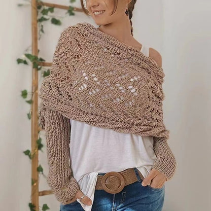 Taupe open-weave lace wrap worn off one shoulder over a white top, with a woven belt at the jeans. 20