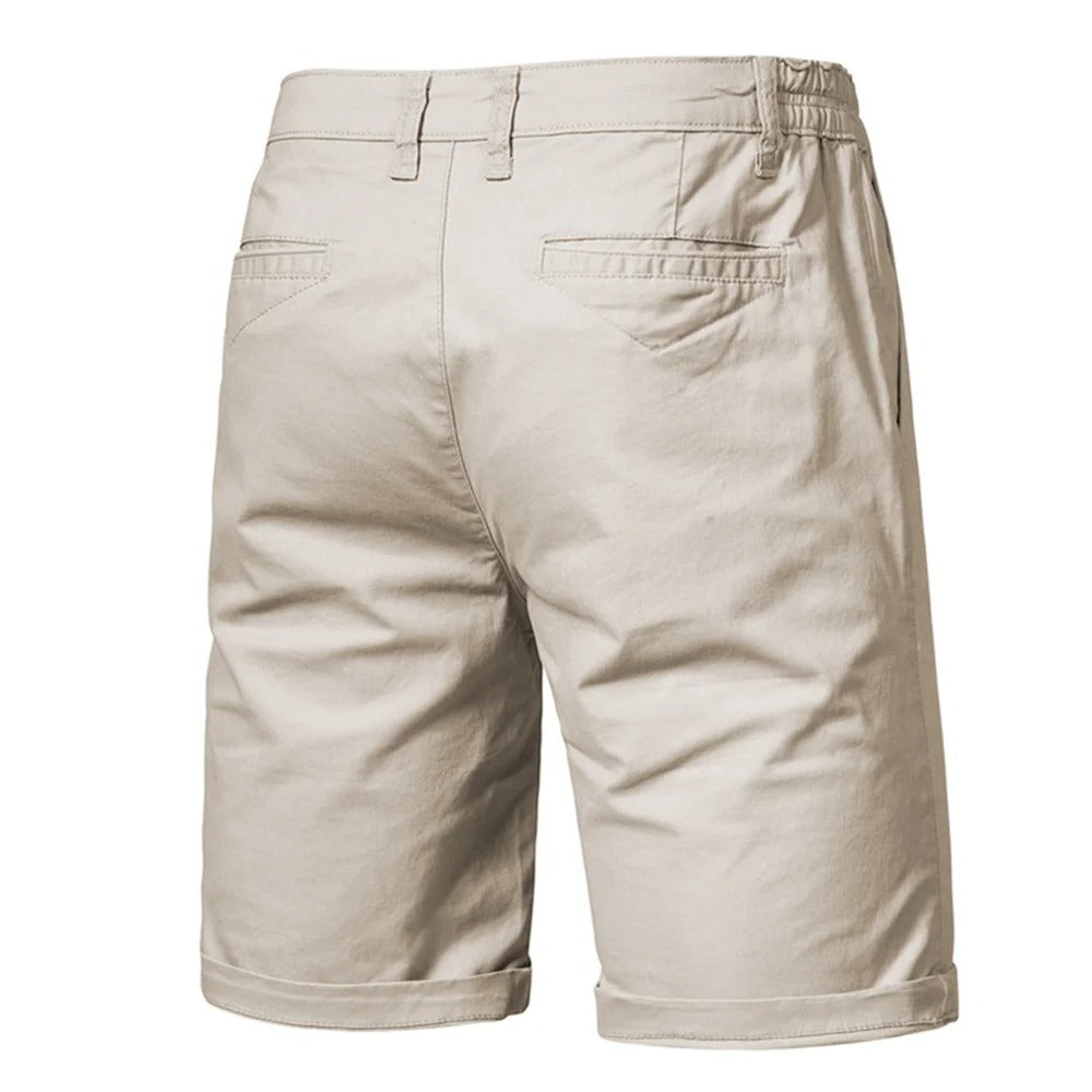 Back view of beige shorts showing two welt pockets, belt loops and rolled hems 2