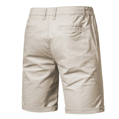 Back view of beige shorts showing two welt pockets, belt loops and rolled hems 2