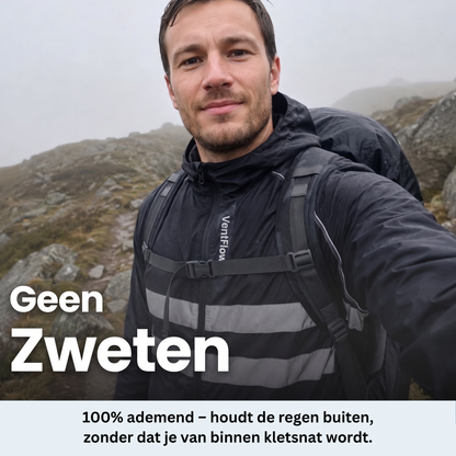 Man in the black jacket with a rucksack taking a selfie on a misty rocky hillside, reflective stripes visible. 9
