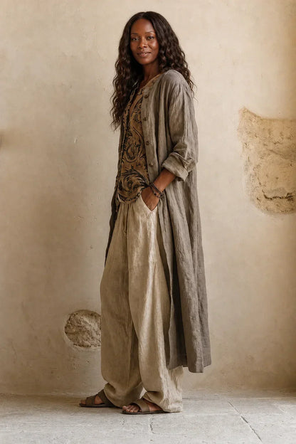 Side view of the model in the three pieces, showing the long cardigan's drape and sleeves 4