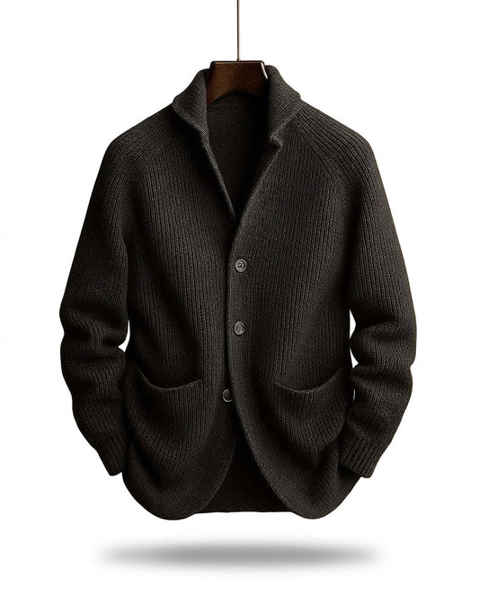 Dark charcoal ribbed cardigan on a wooden hanger, front view with shawl collar and two patch pockets 2