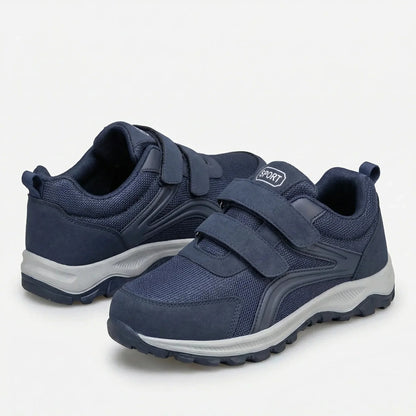 Pair of navy shoes with double straps and grey soles, one shown from behind 9