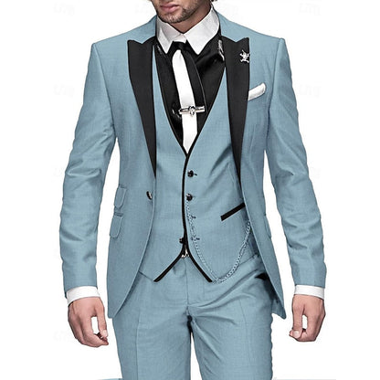 Model in a light blue three-piece suit with black peak lapels, black waistcoat trim, white tie and matching chain. 4