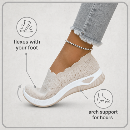Beige knit shoe flexing at the toe on a foot, with callouts on flexibility and arch support 2