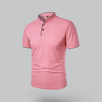 Pink polo shirt seen from the front at an angle, with black buttons and black piped neckband 23
