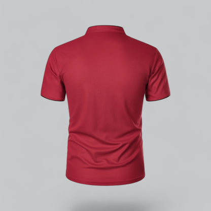 Back view of the red short-sleeved polo shirt, plain across the back with black-edged sleeve hems 26
