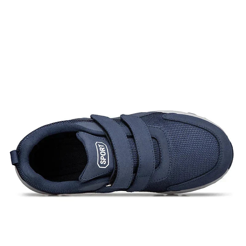 Top-down view of a navy shoe showing the two straps, tongue and opening 14