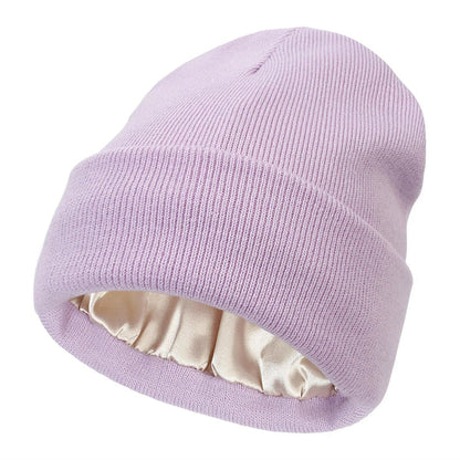 Lilac ribbed knit beanie with turned-up cuff and ruched cream satin lining visible inside 12