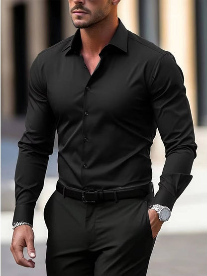 Model walking in the shirt in black, tucked into black trousers with a black belt 3