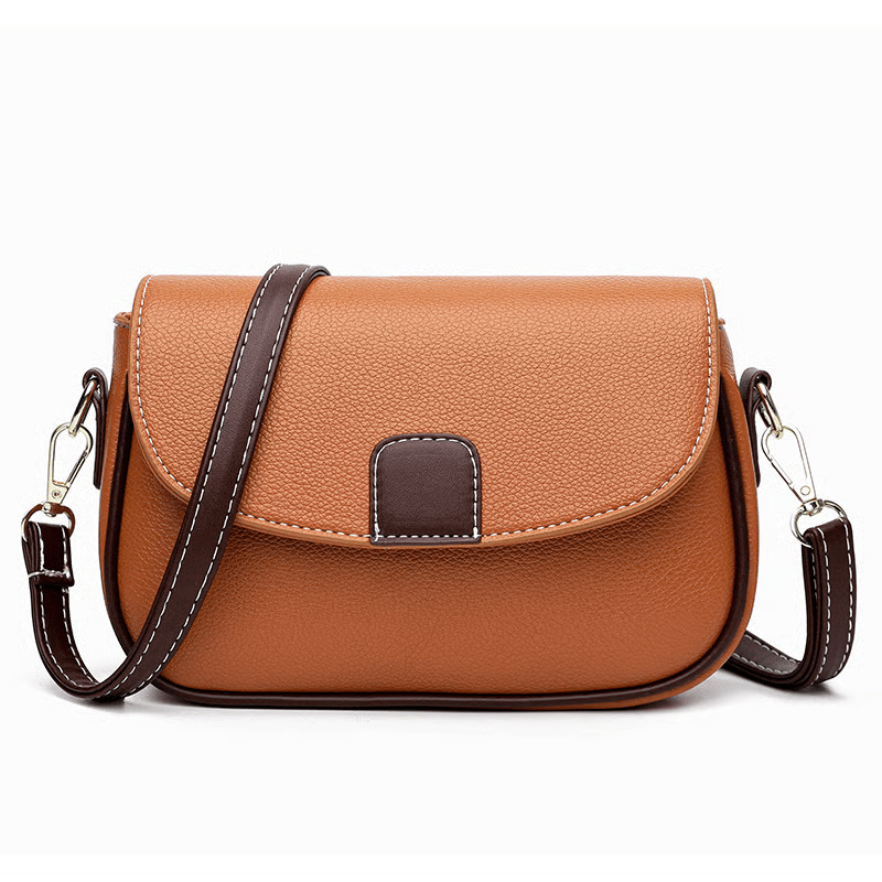 Orange-tan crossbody bag with dark brown strap and trim, photographed front-on on a white background 7