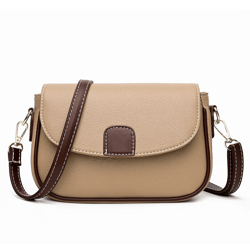Beige crossbody bag with dark brown strap, edging and flap tab, front view on white 6