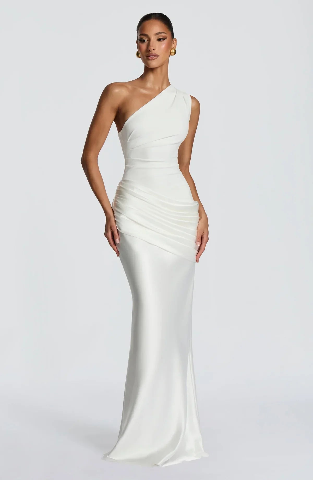 Larger close view of the ivory dress, highlighting the pleated bodice and layered satin drape at the hip. 16