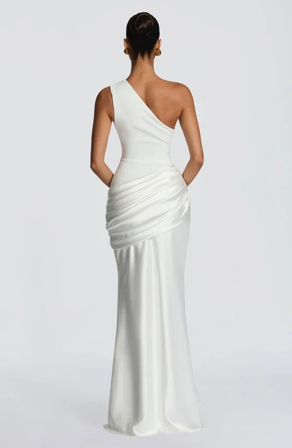 Back view of the ivory dress, with a diagonal back neckline and gathered satin panel over the hips. 17
