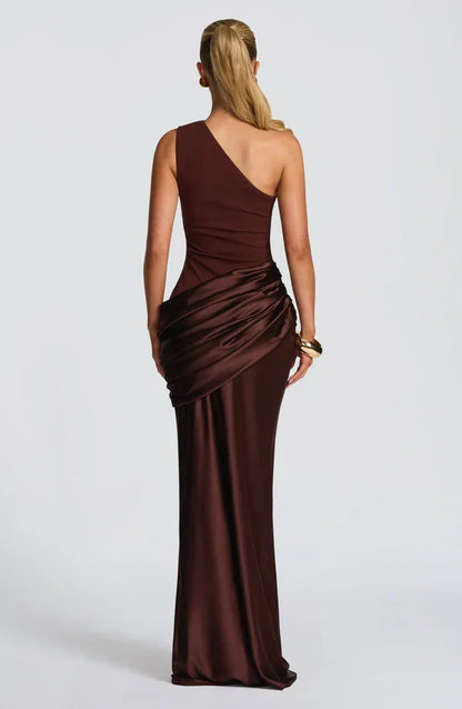 Back view of the chocolate brown dress, showing the sloping neckline and gathered satin hip drape. 9