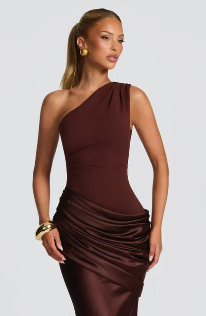 Close-up of the chocolate brown bodice and ruched satin drape, with gold earring and bangle. 12