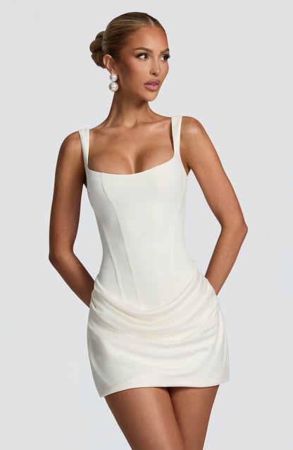 Cream-white version of the dress, front close-up with the square neckline, seamed bodice and draped skirt. 8