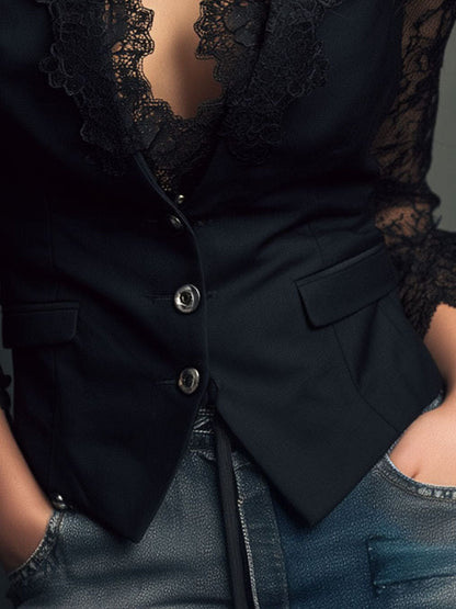 Close-up of the black jacket's front buttons, flap pocket and lace cuff, with hands in jeans pockets 18