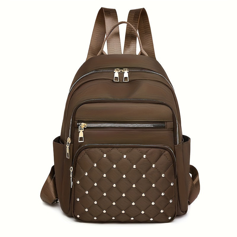 Brown backpack front view with a quilted, gold-studded front pocket and gold zips 15