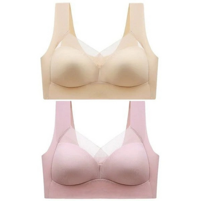 Two seamless bras laid out together, one in beige above one in pink 7