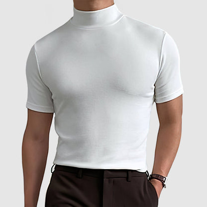 White mock-neck tee worn by a model with dark brown trousers, showing the fitted shape and short sleeves. 8