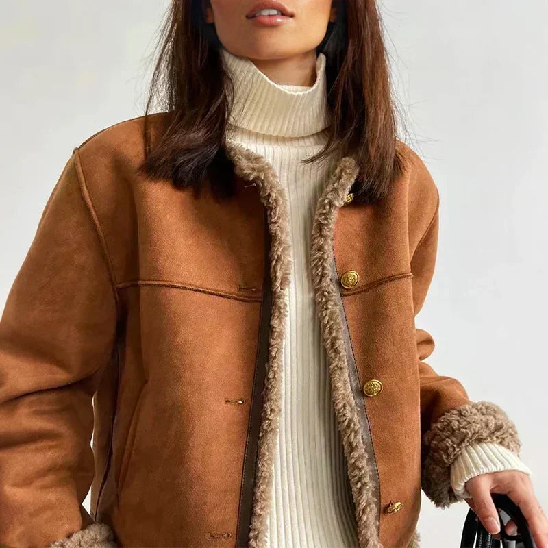 Close-up of the open jacket front showing fleecy trim, gold-tone buttons and a cream ribbed polo neck 2