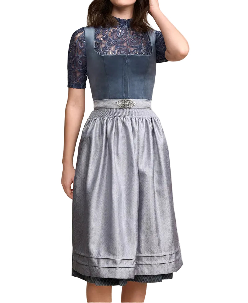 Front view of a model wearing the blue-grey dirndl with lace sleeves, a grey apron with a decorative clasp and pleated trim. 1